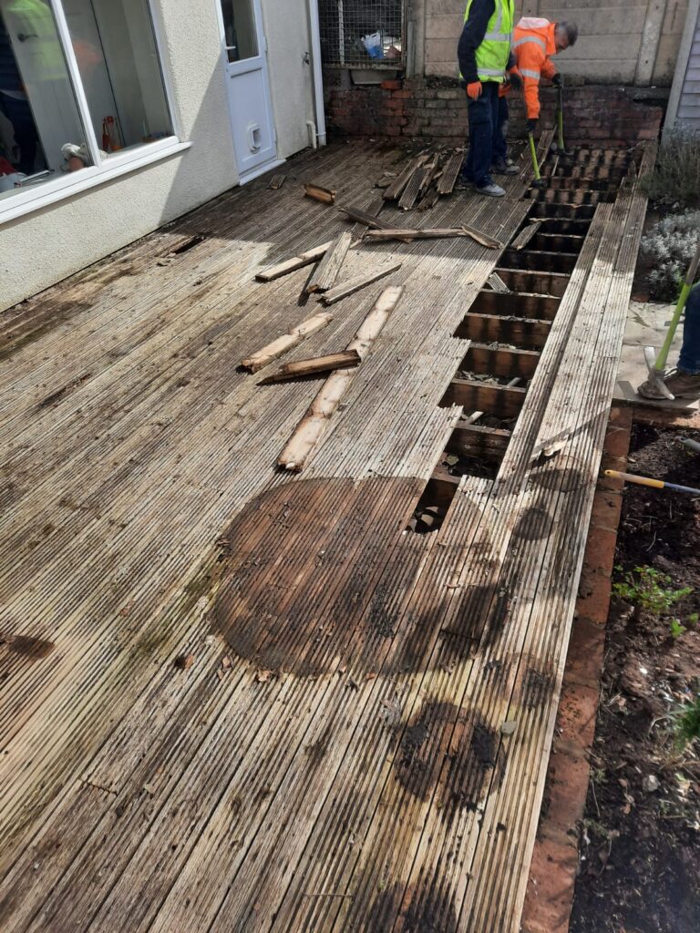 removing old wodden decking and laying new patio slabs in derby
